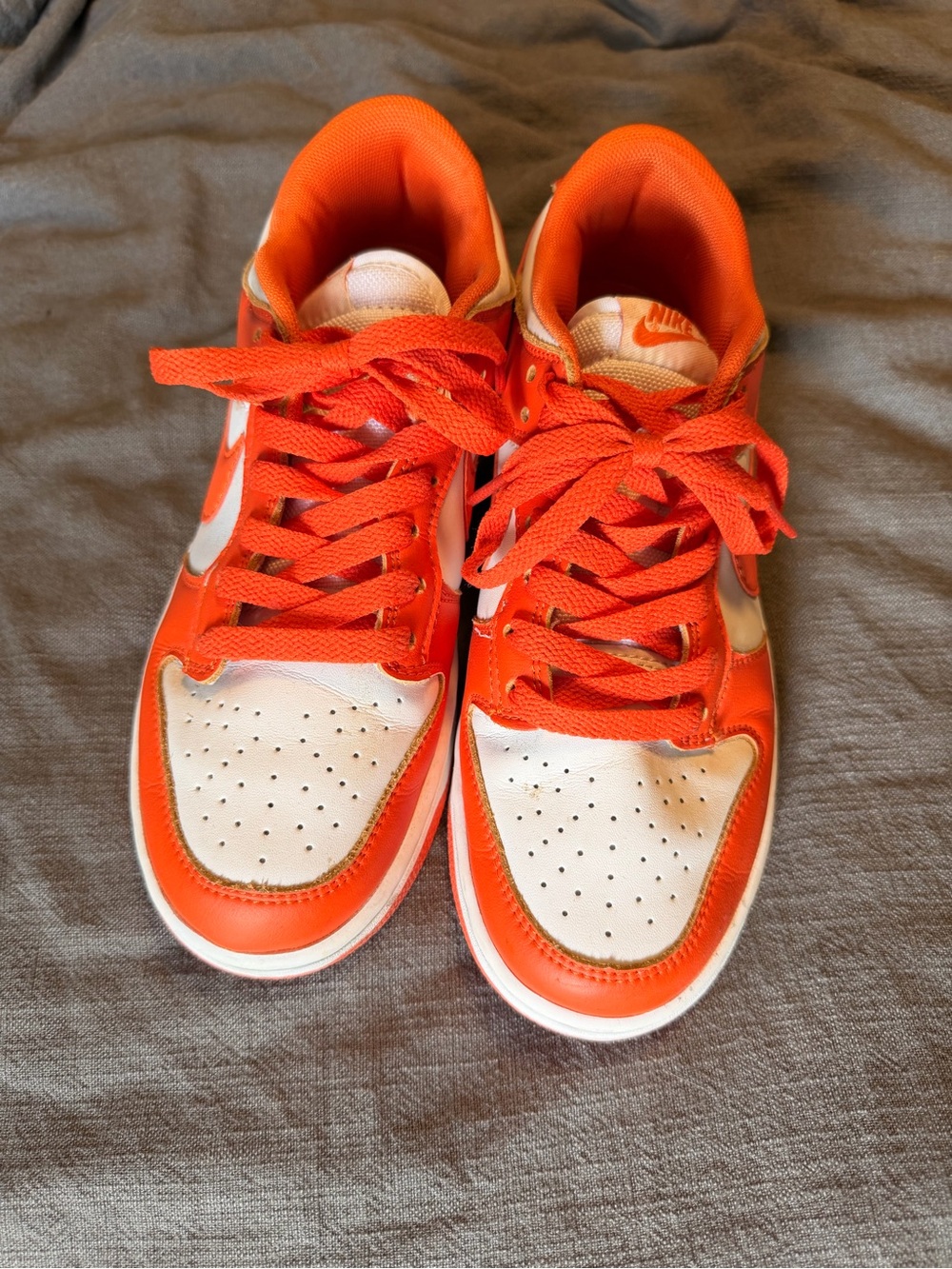 Nike Orange and White Low-Top Sneakers with Bold Swoosh